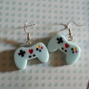 Baby blue video game control earrings